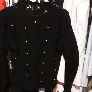 Black knitted sweater with pearl buttons